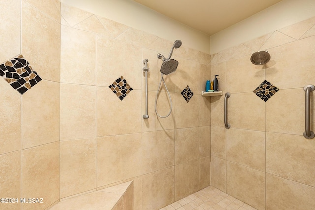 bathroom featuring a tile shower