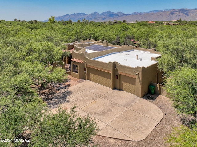 birds eye view of property featuring a mountain view