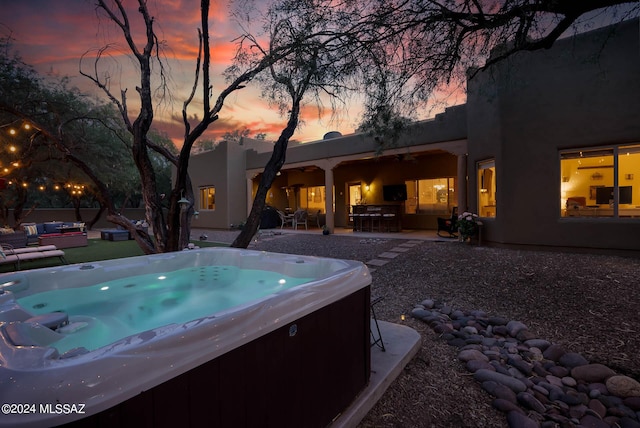 view of swimming pool featuring an outdoor living space, a patio, and a hot tub