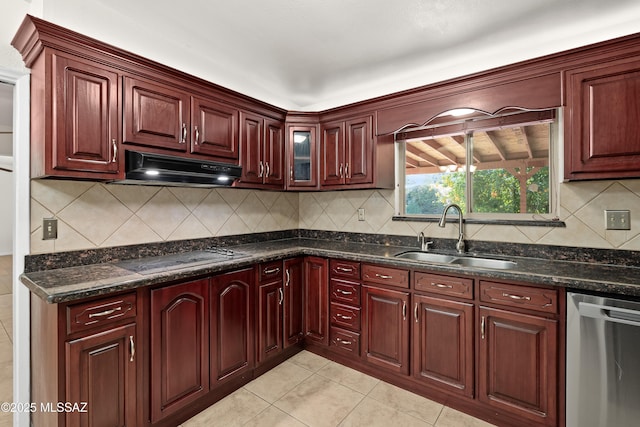 kitchen featuring light tile patterned floors, a sink, under cabinet range hood, stainless steel dishwasher, and white electric cooktop