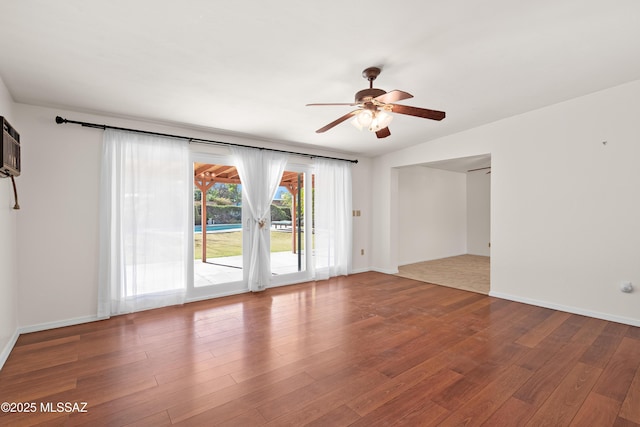 unfurnished room featuring wood finished floors, baseboards, and ceiling fan