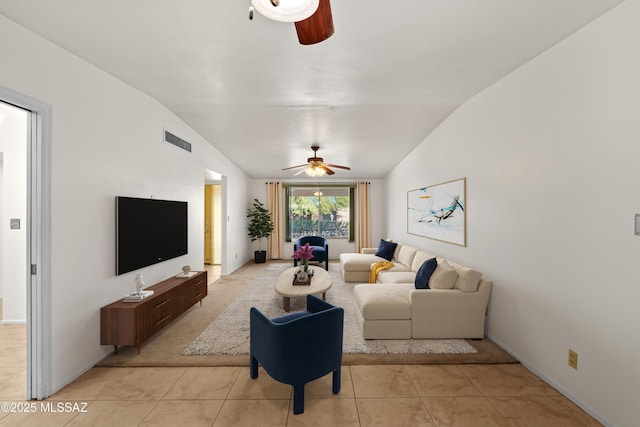 tiled living room featuring ceiling fan and vaulted ceiling