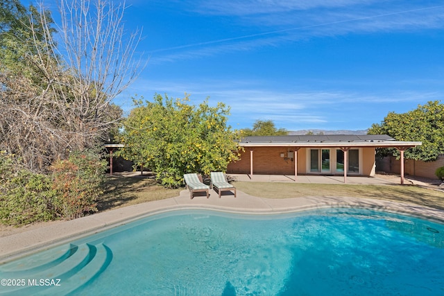 pool featuring a patio area