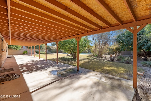 view of patio featuring fence