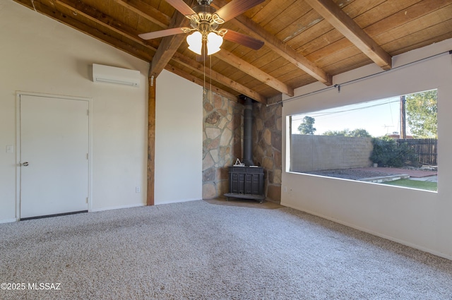 unfurnished living room featuring carpet floors, a wall unit AC, wooden ceiling, vaulted ceiling with beams, and a wood stove