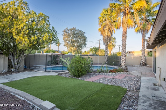 view of yard with a fenced in pool