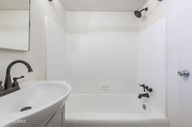 bathroom featuring  shower combination and sink