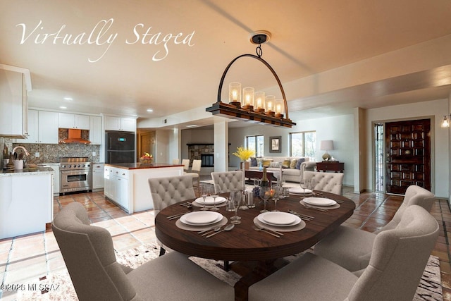 dining space featuring light tile patterned floors