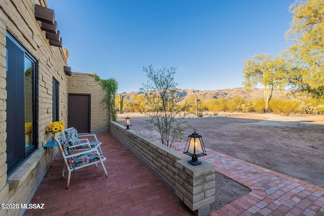 view of patio / terrace with a mountain view