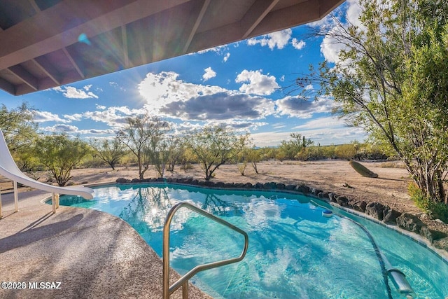 view of pool featuring a water slide