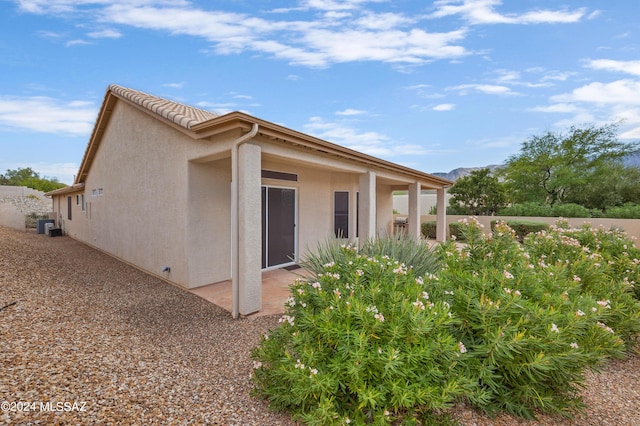 rear view of property featuring a patio