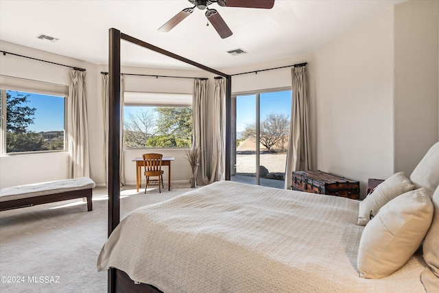 carpeted bedroom with ceiling fan and access to outside