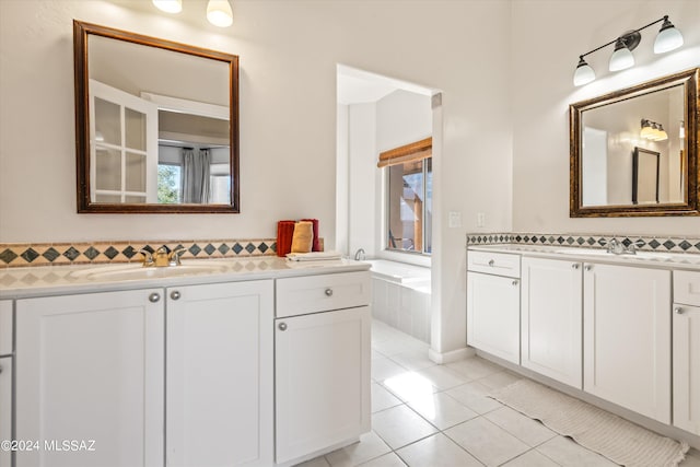 bathroom featuring tile patterned flooring and vanity