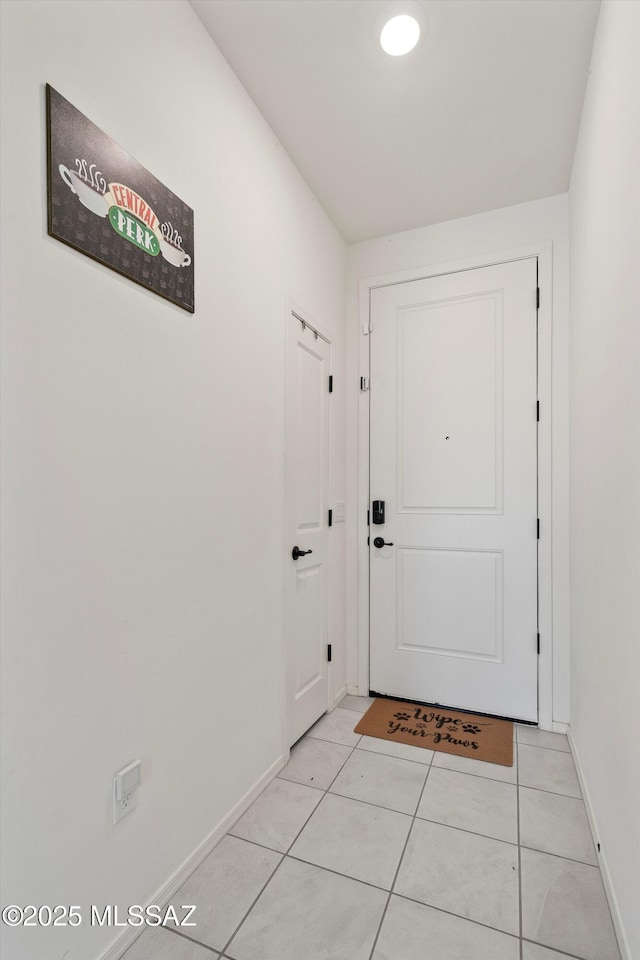 doorway to outside featuring light tile patterned floors