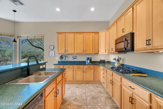 kitchen featuring black appliances, sink, light tile patterned floors, light brown cabinetry, and decorative light fixtures