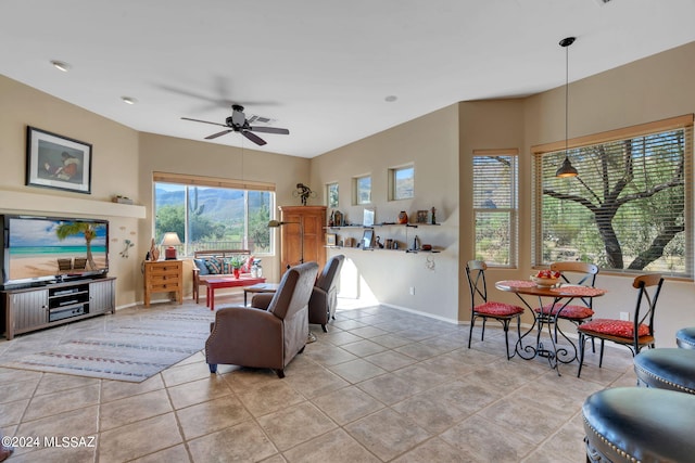 tiled living room featuring ceiling fan