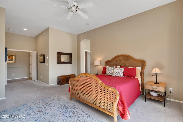 bedroom featuring light colored carpet and ceiling fan