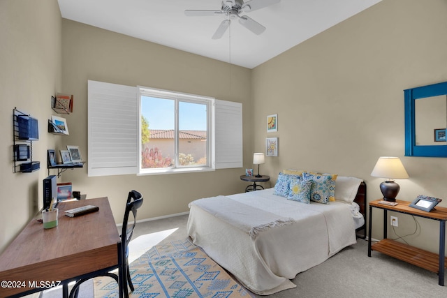 bedroom with light carpet and ceiling fan