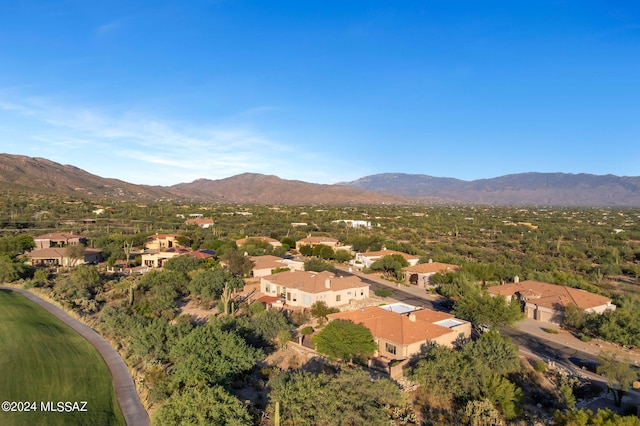 birds eye view of property with a mountain view