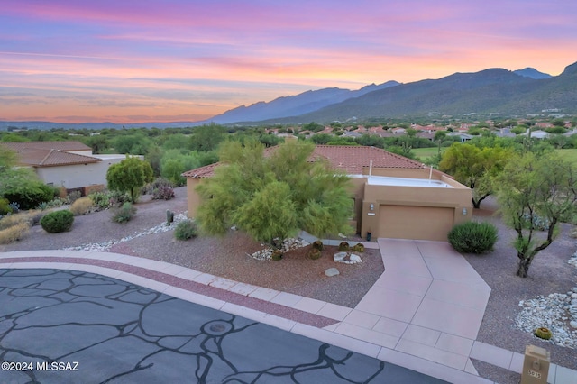 exterior space featuring a mountain view and a garage