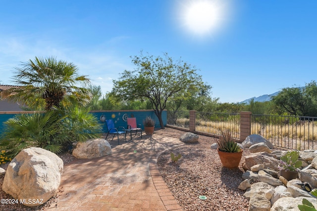 view of patio / terrace featuring a mountain view