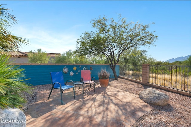 view of patio / terrace featuring a mountain view