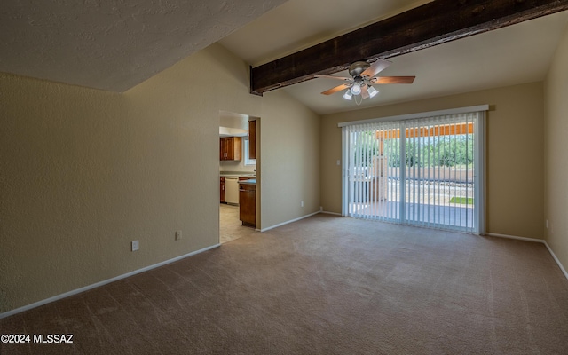 carpeted empty room with lofted ceiling with beams and ceiling fan