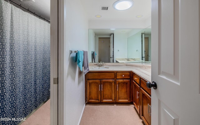 bathroom with a shower with curtain and vanity