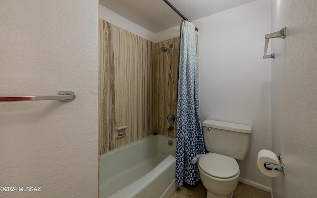 bathroom with a textured ceiling, shower / bath combo, and toilet