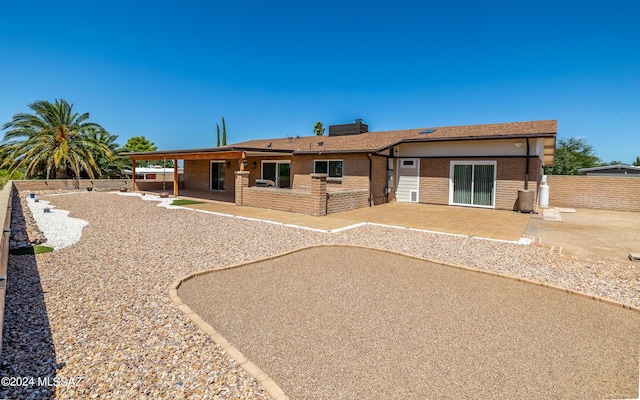 rear view of house featuring a patio area