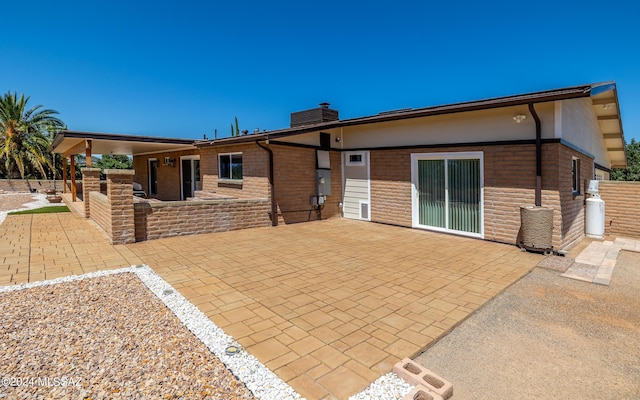 back of property with a patio area