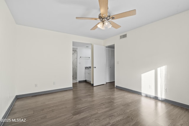 interior space featuring ceiling fan and dark hardwood / wood-style flooring