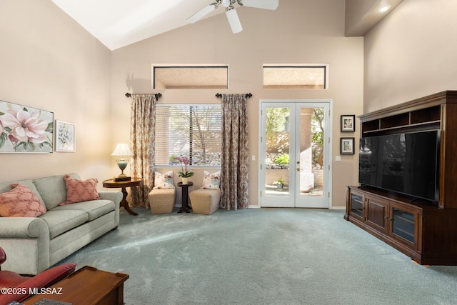 living room with high vaulted ceiling, french doors, ceiling fan, and carpet