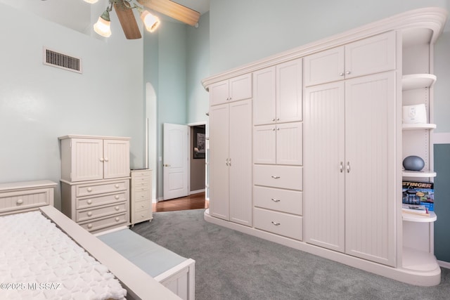 bedroom with carpet, ceiling fan, and a closet