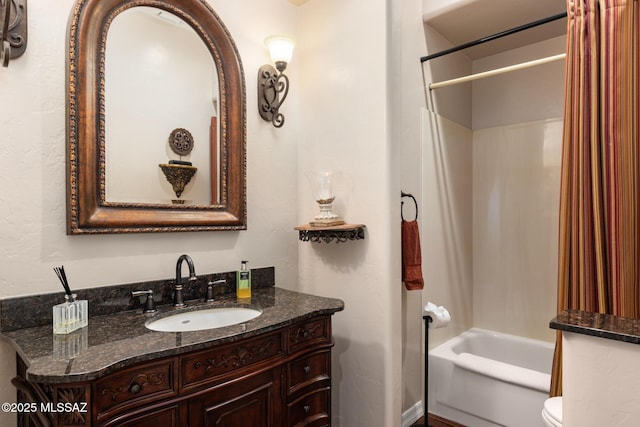 full bathroom with vanity, toilet, and washtub / shower combination