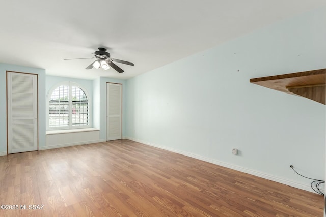 unfurnished room featuring ceiling fan and light hardwood / wood-style floors