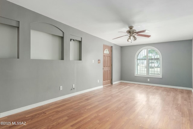 tiled empty room featuring a textured ceiling