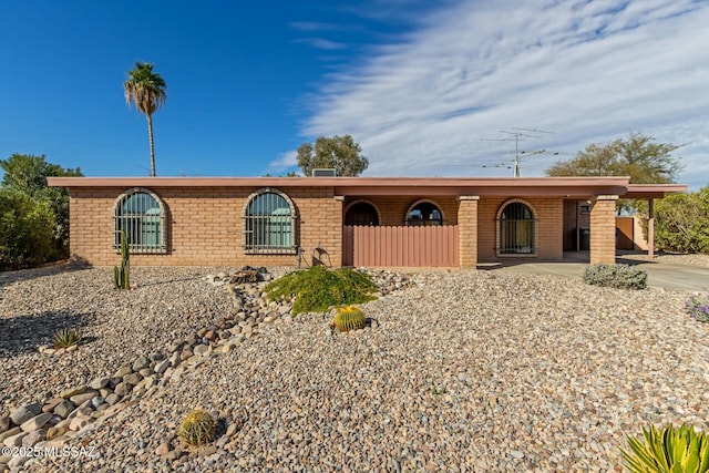 ranch-style home with a carport