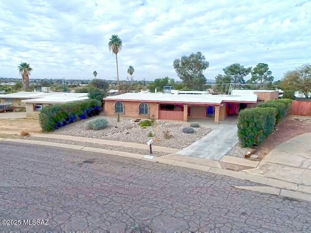 view of front facade with a carport