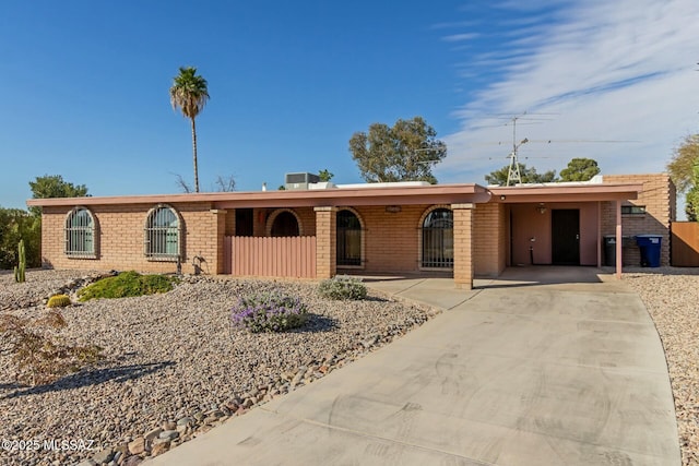 single story home featuring a carport