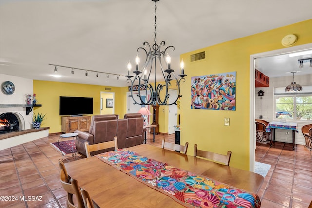 tiled dining area with a notable chandelier