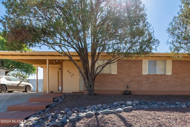 view of front of property with a carport