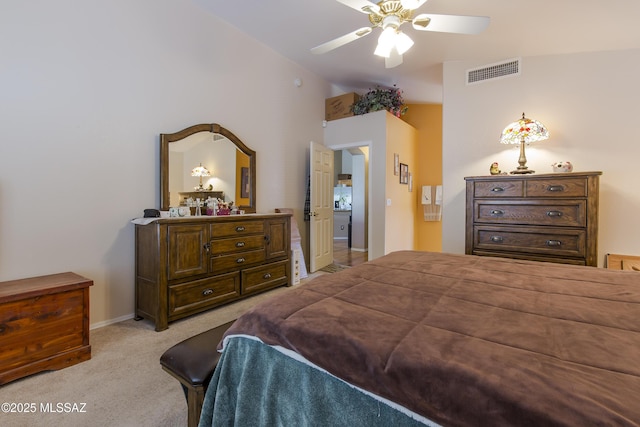 carpeted bedroom featuring visible vents, ceiling fan, baseboards, and vaulted ceiling