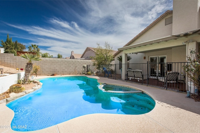 view of pool with a patio, a fenced backyard, and a pool with connected hot tub