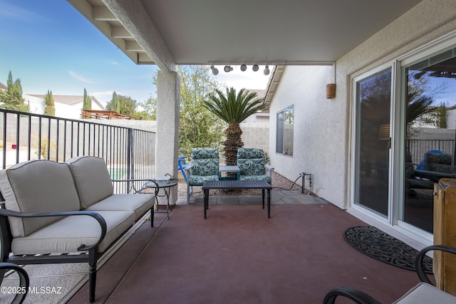 view of patio with outdoor lounge area and fence