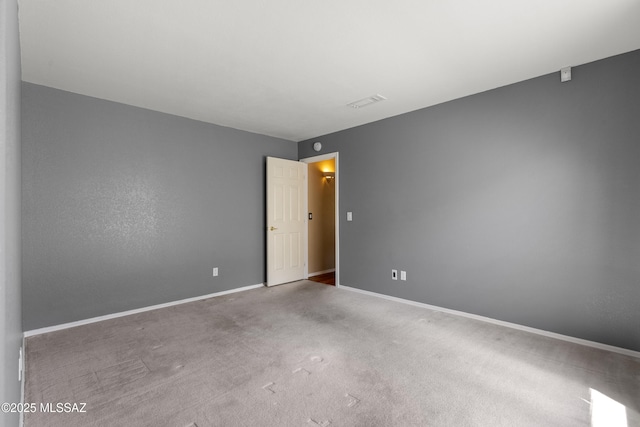 10187 E Watson Dr, Tucson, AZ 85730 - unfurnished room featuring baseboards and carpet