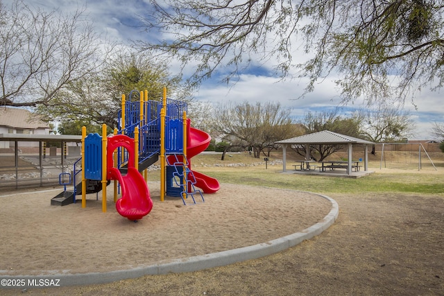 communal playground featuring a gazebo and a lawn