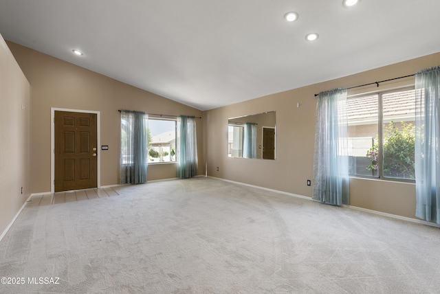 10187 E Watson Dr, Tucson, AZ 85730 - unfurnished living room featuring carpet, lofted ceiling, recessed lighting, healthy amount of natural light, and baseboards