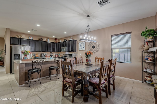 dining space featuring light tile patterned flooring