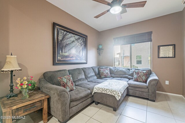 living room featuring ceiling fan and light tile patterned flooring